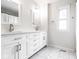 Stylish bathroom featuring double vanities, modern fixtures, and marble flooring, providing a luxurious and functional space at 12577 Pointer Pl, Fishers, IN 46038