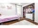 bedroom features a closet with clothes and a white dresser, plus butterfly wall hangings at 12577 Pointer Pl, Fishers, IN 46038