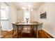 Elegant dining room with hardwood floors, contemporary lighting, and stylish decor; perfect for entertaining and Gathering meals at 12577 Pointer Pl, Fishers, IN 46038