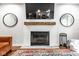 Beautiful brick fireplace with wooden mantel is ready to be used with a TV above at 12577 Pointer Pl, Fishers, IN 46038