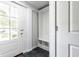 Mud room featuring hexagon tile flooring and built-in shelving for easy organization and storage at 12577 Pointer Pl, Fishers, IN 46038
