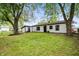 Backyard with new home with white siding and a detached shed, and green lawn at 1295 Rolling Ridge Dr, Noblesville, IN 46060