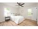 Bright bedroom with hardwood floors, neutral bedding, and ample natural light at 1295 Rolling Ridge Dr, Noblesville, IN 46060