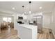 Modern kitchen featuring stainless steel appliances, white cabinetry and a center island at 1295 Rolling Ridge Dr, Noblesville, IN 46060