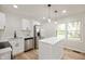 Contemporary kitchen featuring stainless steel appliances, a center island, and lots of natural light at 1295 Rolling Ridge Dr, Noblesville, IN 46060