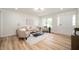 Bright living room featuring hardwood floors, neutral decor, and ample natural light at 1295 Rolling Ridge Dr, Noblesville, IN 46060