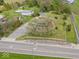 Aerial view showing large home with mature trees, long drive, and convenient road access at 1394 N Michigan Rd, Shelbyville, IN 46176