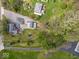 Aerial view of the property, including the home, detached garage, and expansive green space at 1394 N Michigan Rd, Shelbyville, IN 46176
