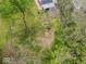 Aerial view of a property with grassy yard, featuring mature trees and convenient outdoor seating at 1394 N Michigan Rd, Shelbyville, IN 46176