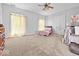Bedroom with carpet, grey walls, and a ceiling fan at 1394 N Michigan Rd, Shelbyville, IN 46176