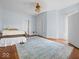 Bedroom with hardwood floors and soft blue walls at 1394 N Michigan Rd, Shelbyville, IN 46176
