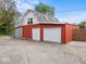 Exterior view of barn with multiple doors and parking area at 1394 N Michigan Rd, Shelbyville, IN 46176