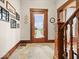 Charming foyer with decorative wood trim, tiled floors, and a staircase, offering a warm welcome at 1394 N Michigan Rd, Shelbyville, IN 46176