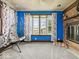 Bright living room features a bay window, accent wall, and a brick fireplace at 1394 N Michigan Rd, Shelbyville, IN 46176