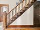 Staircase with wood treads, banister, and trim at 1394 N Michigan Rd, Shelbyville, IN 46176