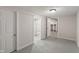 Finished basement room with a view of the unfinished utility area and bathroom at 1627 Lawton Ave, Indianapolis, IN 46203