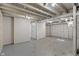 Unfinished basement featuring exposed beams and a painted floor at 1627 Lawton Ave, Indianapolis, IN 46203