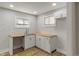 Bright kitchen featuring butcher block countertops, fresh white cabinets, stainless steel sink and faucet at 1627 Lawton Ave, Indianapolis, IN 46203