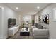 Staged living room with seamless flow into kitchen, modern furniture, and decor create an inviting and stylish space at 1627 Lawton Ave, Indianapolis, IN 46203
