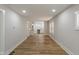 Spacious living room with seamlessly flows into the kitchen space, enhancing the home's layout and appeal at 1627 Lawton Ave, Indianapolis, IN 46203