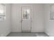 Mud room area with a decorative glass front door and horizontal bead board walls at 1627 Lawton Ave, Indianapolis, IN 46203