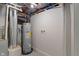 Basement utility area with water heater and plumbing at 1627 Lawton Ave, Indianapolis, IN 46203
