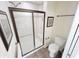 Full bathroom with glass enclosed shower and neutral tile at 16924 Maple Springs Way, Westfield, IN 46074