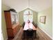 Traditional dining room with rug, arched window, chandelier, and china cabinet at 16924 Maple Springs Way, Westfield, IN 46074
