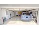 Organized two car garage with ample storage and a blue SUV parked inside at 16924 Maple Springs Way, Westfield, IN 46074