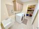 Functional laundry room with sink, washer, dryer and built-in cabinets at 16924 Maple Springs Way, Westfield, IN 46074