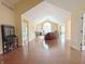 Spacious living room featuring hardwood floors, a fireplace, and ample natural light at 16924 Maple Springs Way, Westfield, IN 46074