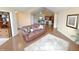 Cozy living room with hardwood floors, a comfortable brown leather sofa and natural light at 16924 Maple Springs Way, Westfield, IN 46074