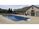 Community pool surrounded by elegant stonework offers a refreshing escape at 16924 Maple Springs Way, Westfield, IN 46074