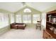 Bright sunroom with natural light, comfortable seating, and a vaulted ceiling at 16924 Maple Springs Way, Westfield, IN 46074