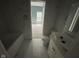 Bathroom featuring tiled floor, contemporary toilet, tub, and sink at 1824 Spann Ave, Indianapolis, IN 46203
