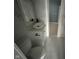 Bathroom featuring tiled floor, modern vanity, mirror and contemporary toilet at 1824 Spann Ave, Indianapolis, IN 46203
