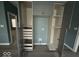 A kitchen pantry and storage area with modern grey cabinets, drawers, and door at 1824 Spann Ave, Indianapolis, IN 46203