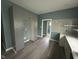 Spacious kitchen with gray cabinets, tiled backsplash, and gray hardwood flooring at 1824 Spann Ave, Indianapolis, IN 46203
