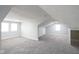 Spacious, carpeted attic area with natural light and multiple windows, perfect for a playroom or extra living space at 1835 N Rural St, Indianapolis, IN 46218