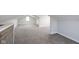 Large attic space with carpet flooring, dormer windows, and ample room for storage or flexible use at 1835 N Rural St, Indianapolis, IN 46218