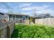 Fenced backyard with healthy lawn, ensuring privacy and a secure space for outdoor activities and relaxation at 1835 N Rural St, Indianapolis, IN 46218