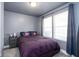 Comfortable bedroom with plush bedding and soft, natural lighting at 1835 N Rural St, Indianapolis, IN 46218