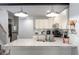 Bright kitchen features granite countertops, stainless steel appliances and a stylish island at 1835 N Rural St, Indianapolis, IN 46218