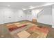 This unfinished basement has an area rug on the floor and a staircase at 1907 N Alabama St, Indianapolis, IN 46202