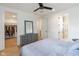 Bedroom featuring a gray dresser, multiple entrances, and a glimpse into the walk-in closet at 1907 N Alabama St, Indianapolis, IN 46202