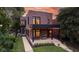 Beautiful two-story home with a covered porch perfect for relaxing, complemented by a manicured lawn at 1907 N Alabama St, Indianapolis, IN 46202