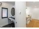 Laundry area with stacked washer and dryer, countertop, and workspace nearby at 1907 N Alabama St, Indianapolis, IN 46202
