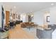 Open-concept living space featuring hardwood floors, modern decor, and a seamless transition to the kitchen at 1907 N Alabama St, Indianapolis, IN 46202