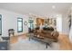 Bright living area boasting hardwood floors, modern furnishings, and an open flow to the dining and kitchen spaces at 1907 N Alabama St, Indianapolis, IN 46202