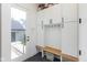 This mudroom is spacious and features custom cabinets, hooks, and a seating area at 1907 N Alabama St, Indianapolis, IN 46202